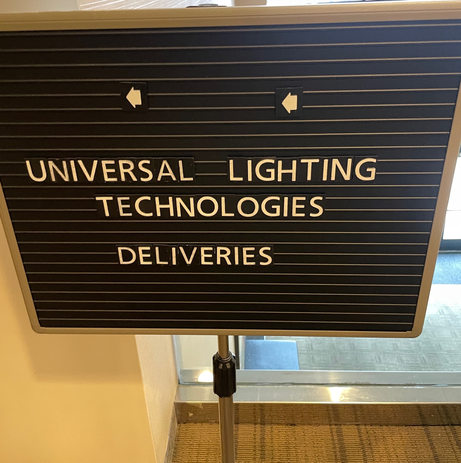 Sign reading: Universal Lighting Technologies Deliveries 