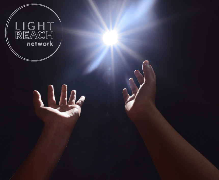 Image of 2 open hands with the Light Reach Network logo
