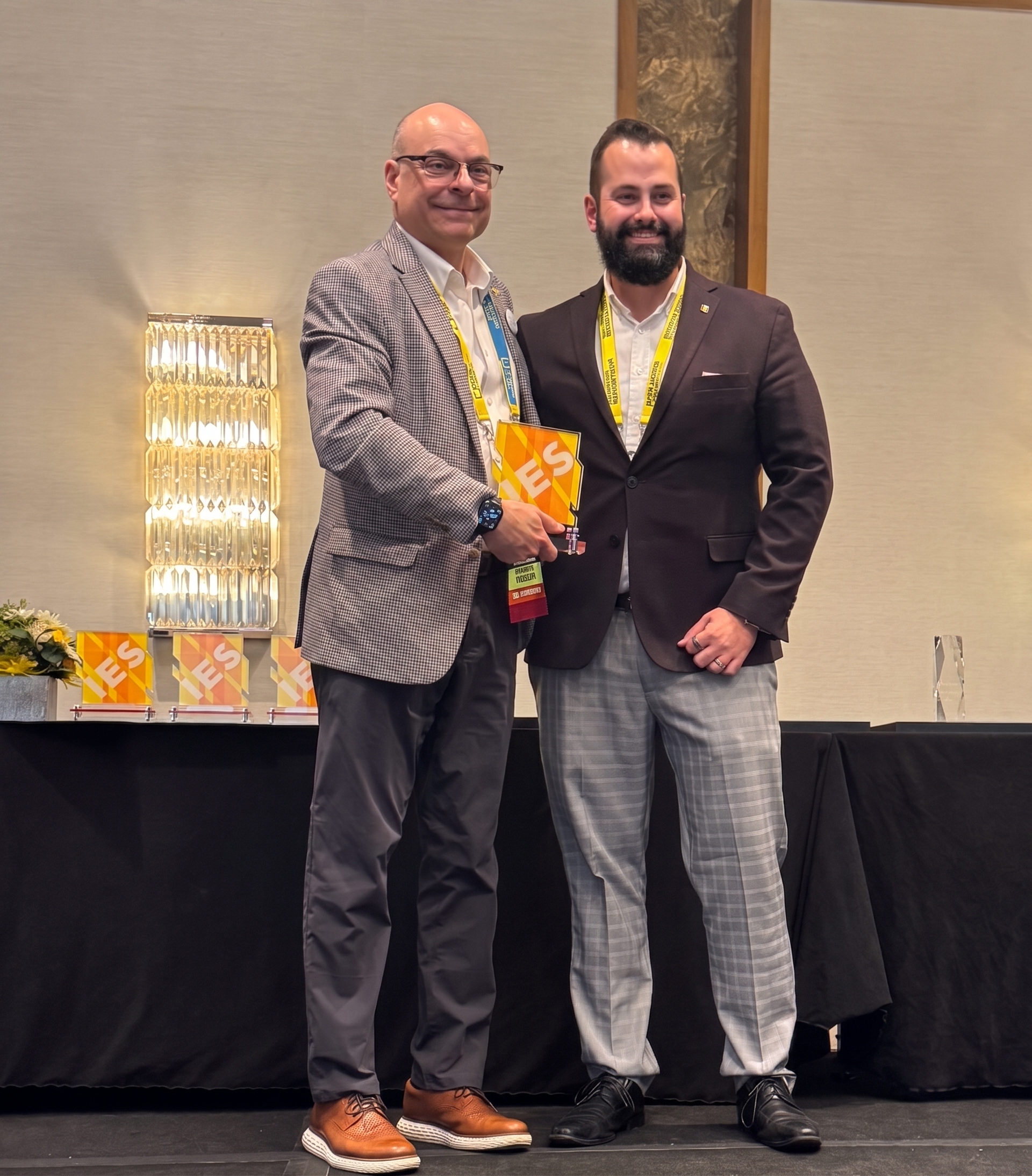 Wilson Dau Receives the Past President Award at IES 26