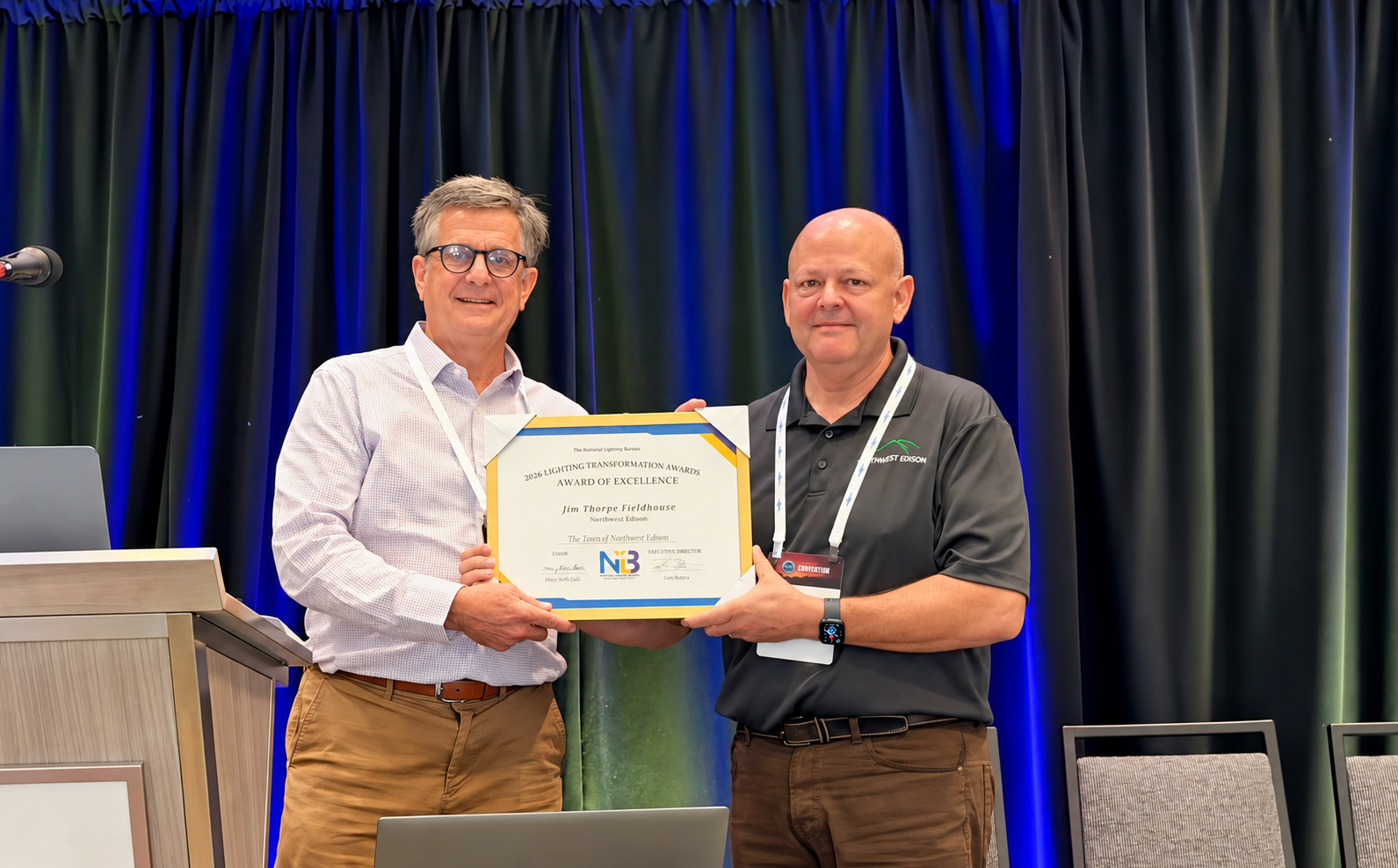Randy Reid presents an NLB Transformation Award of Excellence to Dan Camilleri of Northwest Edison
